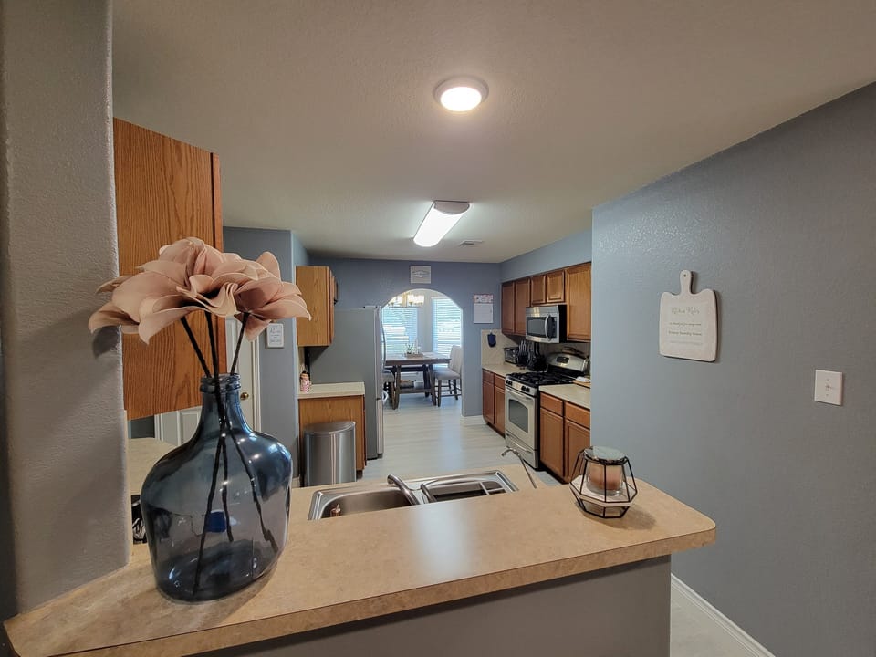 Kitchen area view from open concept from living room.