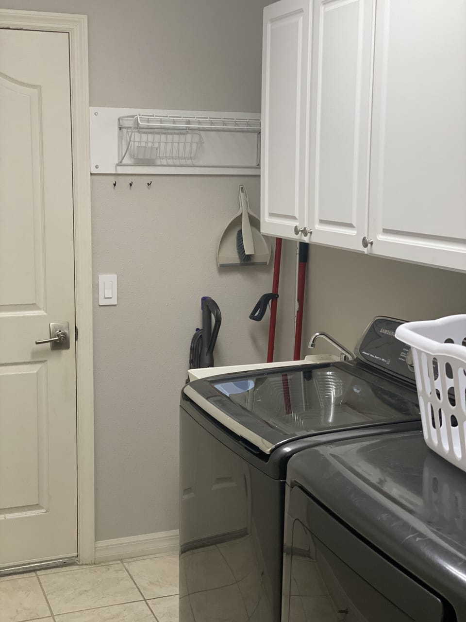 Attached Garage Entrance and Laundry Room with Washer/Dryer and Laundry Tub