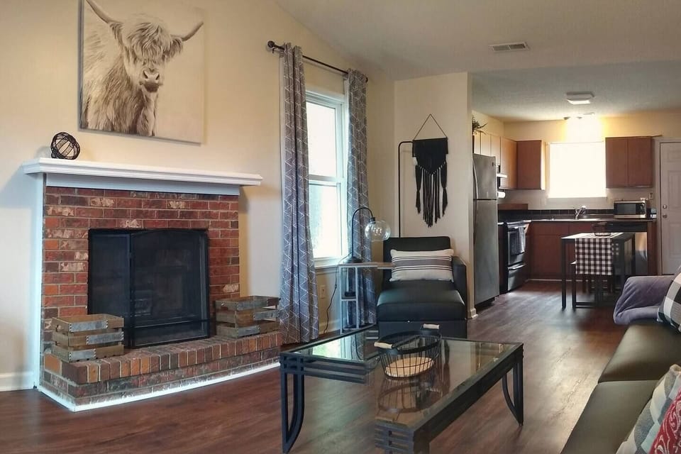 Relax and unwind by the fireplace in our spacious living area, where comfort and warmth meet.