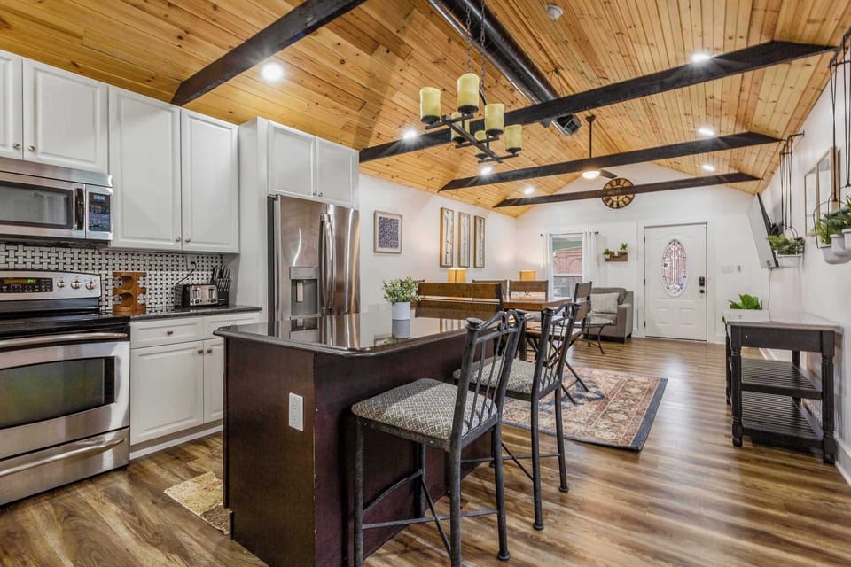 Fully equipped kitchen with stainless appliances and ample space.