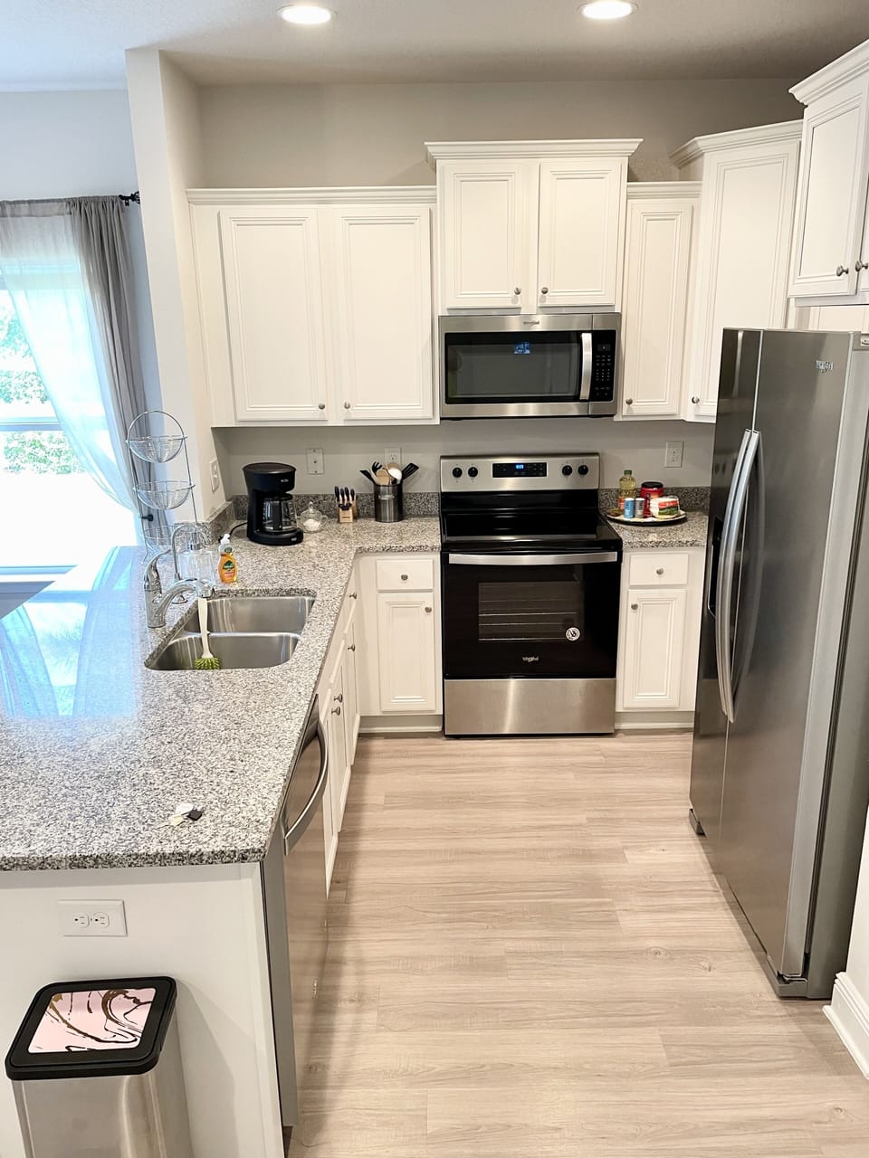 Well stocked kitchen , with stainless steels appliances and granite countertops 