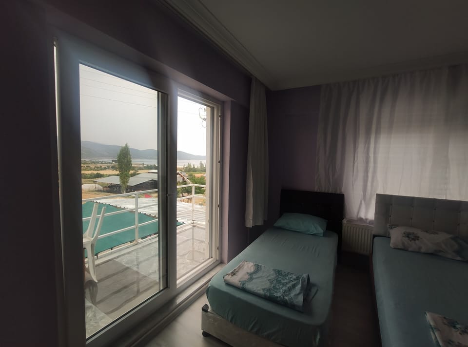 Family Quadruple Room, Multiple Beds, Balcony, Lake View | Premium bedding, individually decorated, individually furnished, desk