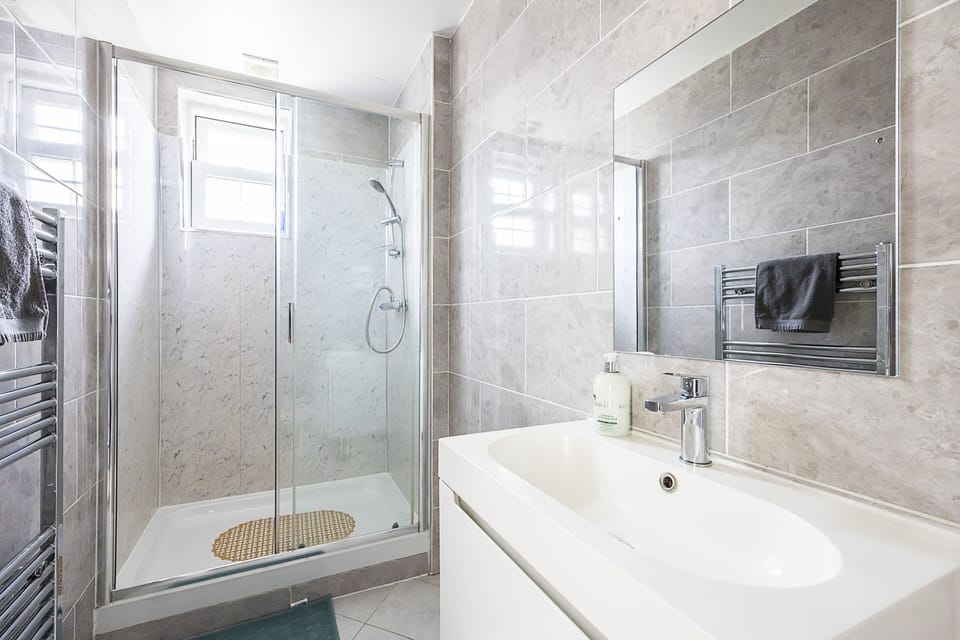 Shower, rainfall showerhead, towels
