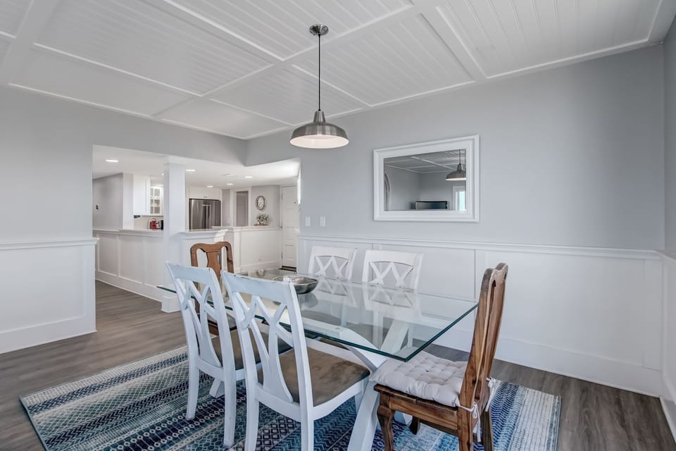 Dining Space with Glass Topped Table and Seating for 6