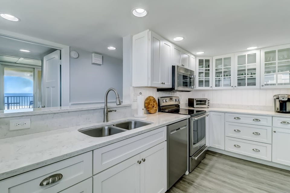 Sparkling Fully Equipped Kitchen with Quartz Countertops and Stainless Appliances