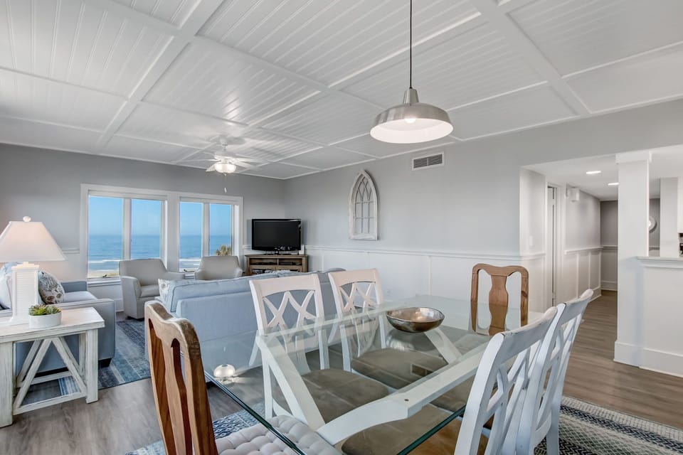 Dining Space with Glass Topped Table and Seating for 6