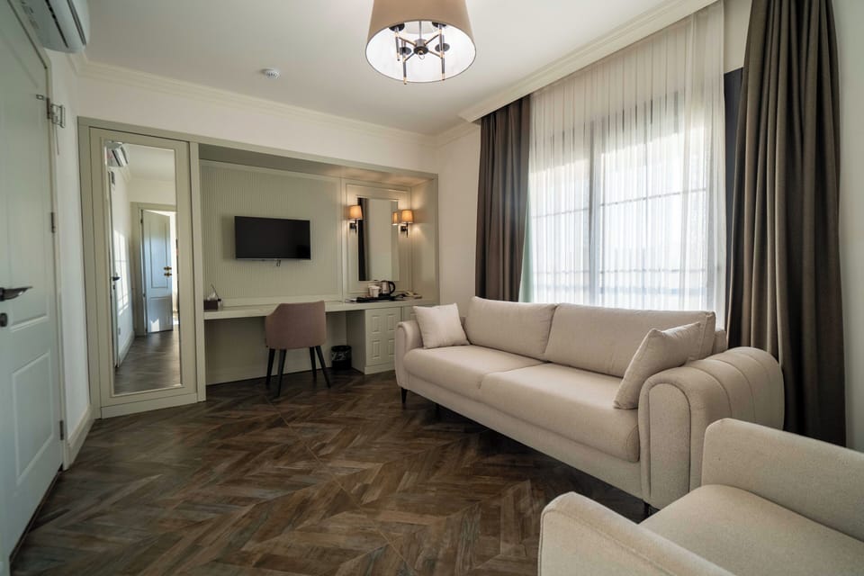 Standard Suite | Living area | Plasma TV