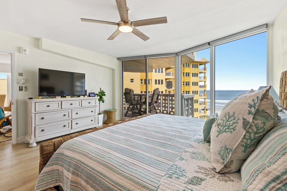 Coastal primary bedroom with a king-sized bed.