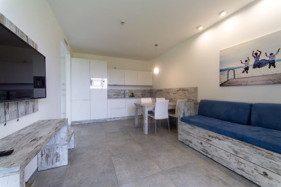 Apartment (Garda) | Living area | 42-inch flat-screen TV with satellite channels, TV