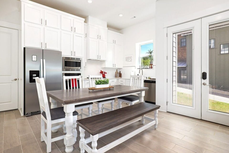 In the kitchen, you'll have access to amenities such as a Keurig, high-end appliances and plenty of built-in storage. You'll also have access to a large glass door leading out to the side of the house.