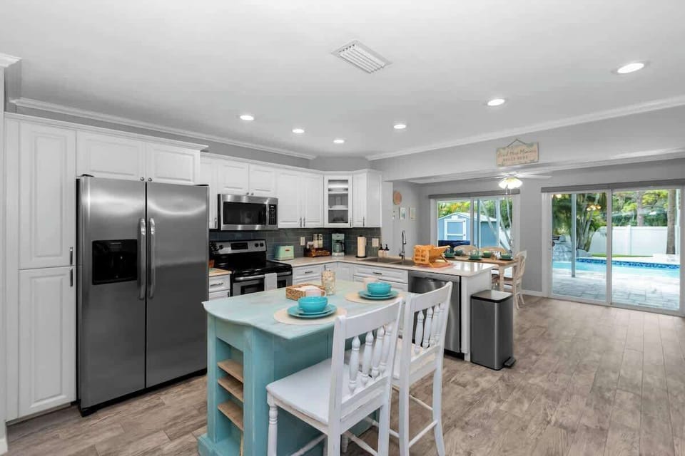 Coastal cool fully stocked kitchen and island seating