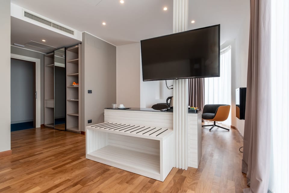Junior Double or Twin Room | Minibar, in-room safe, desk, laptop workspace