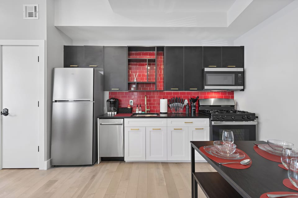 Fully-equipped kitchen with modern stainless steel appliances, ample countertop space, and a wide range of cookware, ensuring a seamless cooking experience for all your culinary needs.




