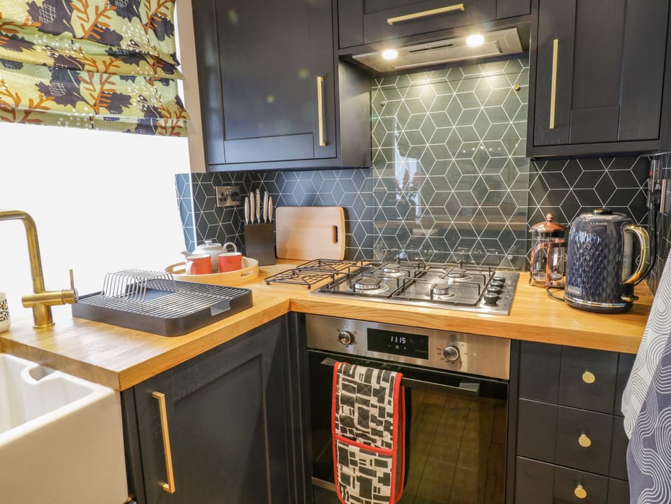 Fridge, electric kettle, toaster, cookware/dishes/utensils