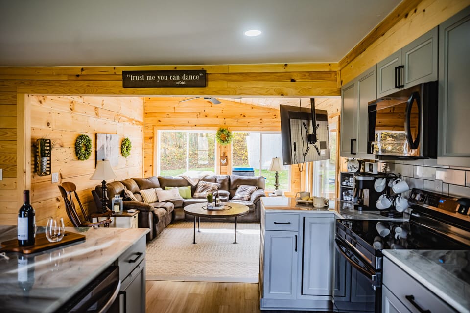 Designed with family and friends in mind, our open-concept living space makes it easy to spend quality time together. Whether you're preparing meals in the fully equipped kitchen, sharing stories around the island, or relaxing on the oversized sectional, everyone stays connected without feeling crowded.

The spacious layout creates the perfect setting for holiday gatherings, weekend getaways, game nights, and making memories that last long after your stay. Cozy, inviting, and thoughtfully designed—it's a place where everyone can feel right at home.