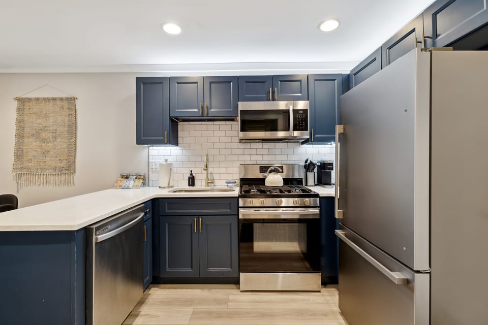 Updated well stocked kitchen with stainless steel appliances