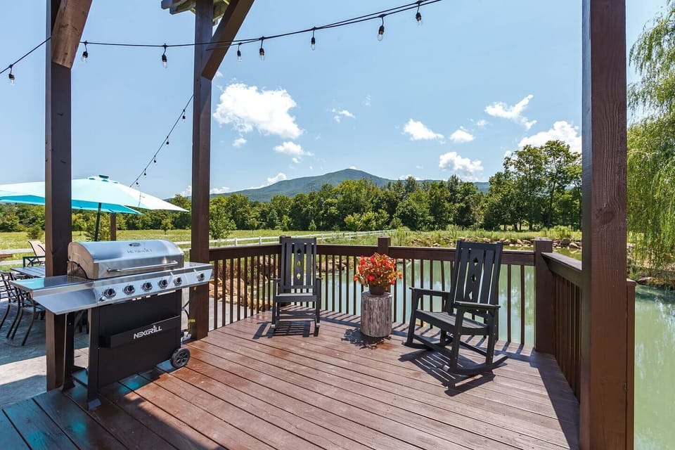 Breathtaking views at your outdoor Grill and patio seating. Mountain reflections on the water, yes please!