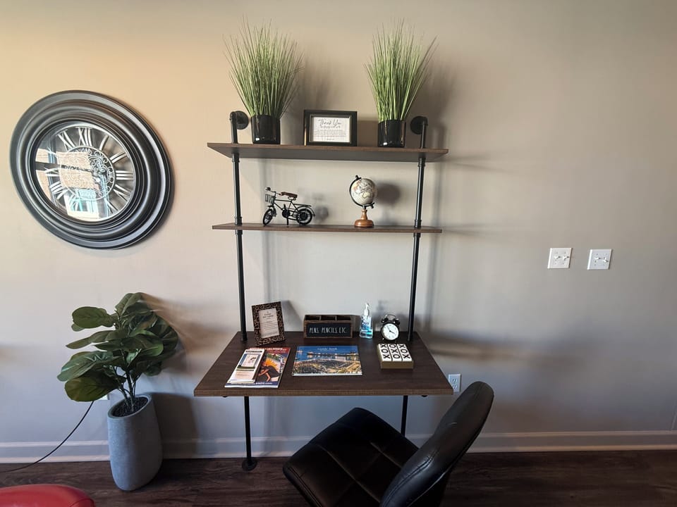 Dedicated workspace with desk, décor, and natural light. Ideal for remote work or planning your next day of adventure.