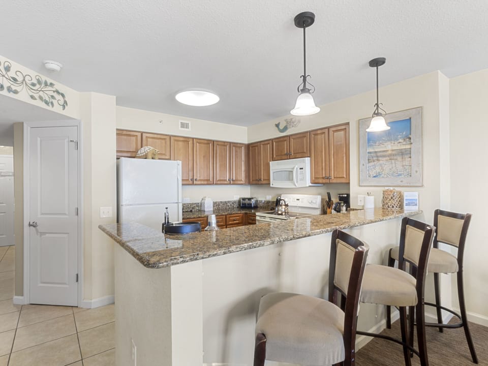 Your spacious kitchen awaits with granite countertops and modern appliances for preparing memorable meals together.