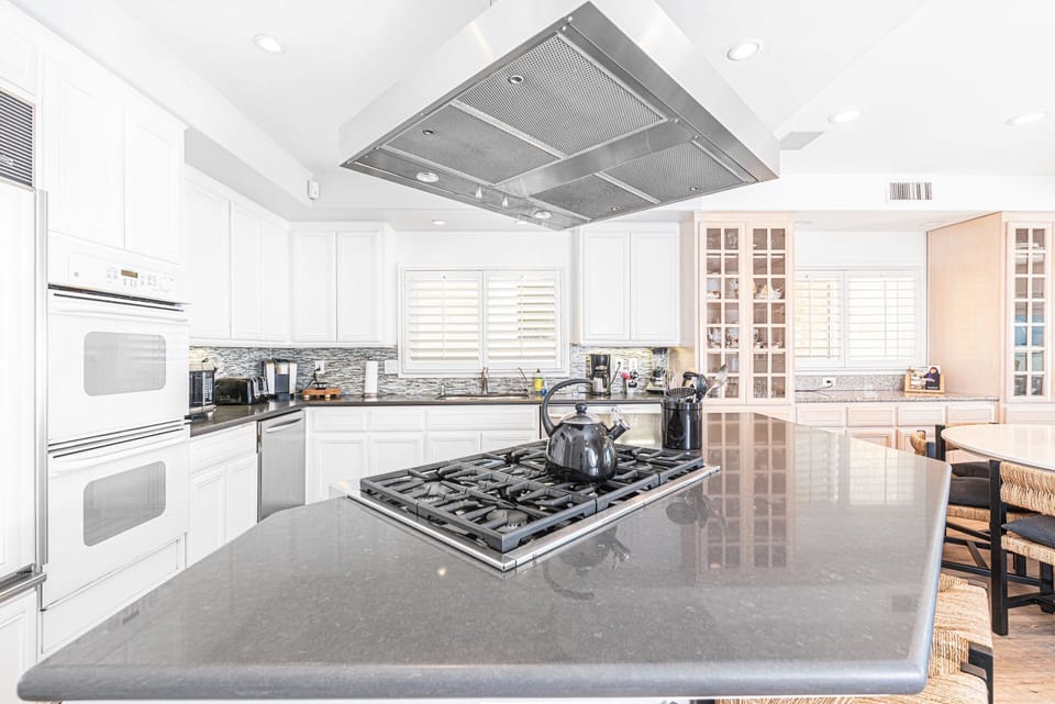 The kitchen comes stocked with dishes, utensils, cookware, bakeware, and large & small appliances.
                