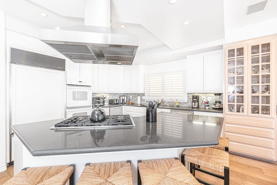 The bar stool seating makes meal prep a social affair!
                