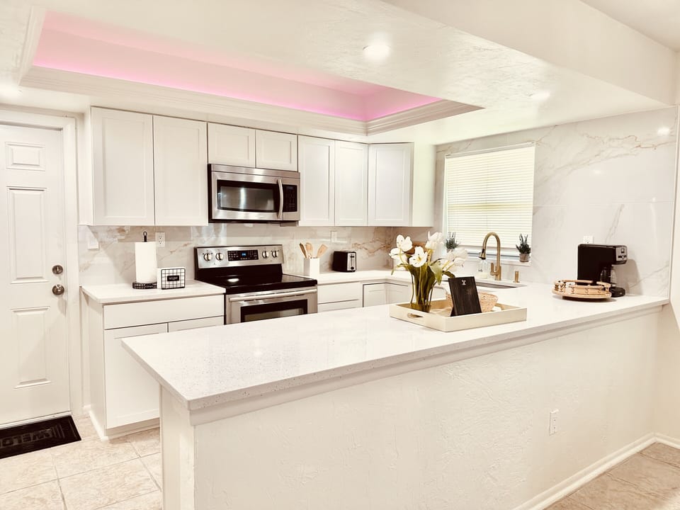 Freshly renovated kitchen with stainless steel appliances.