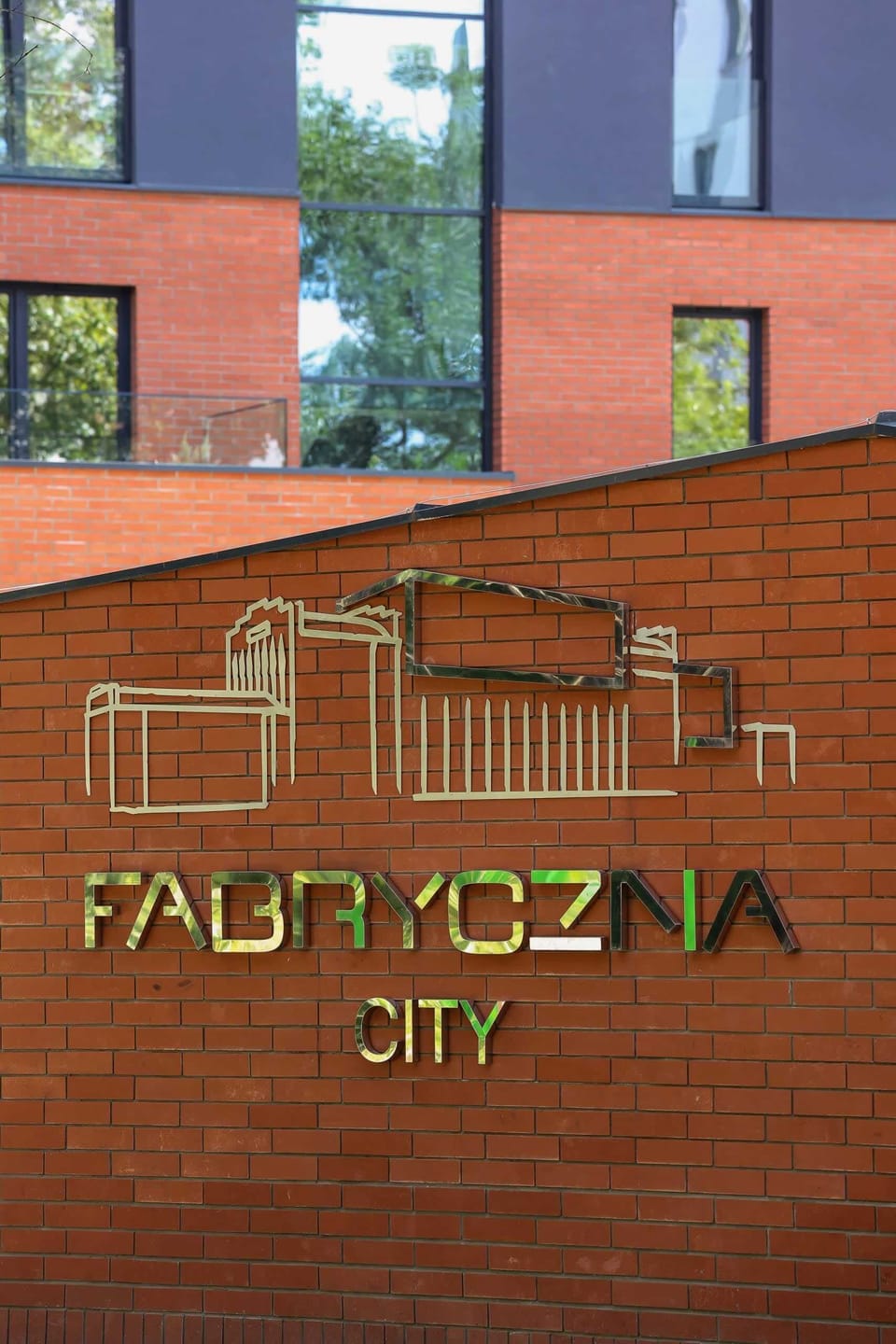 A stylish logo and signage of the residential complex, showcasing its name and unique branding.
