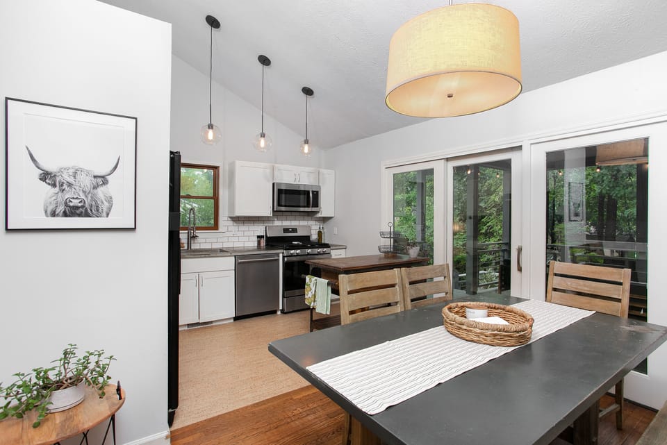 Dine together or step out to the porch; sliding doors connect both spaces.