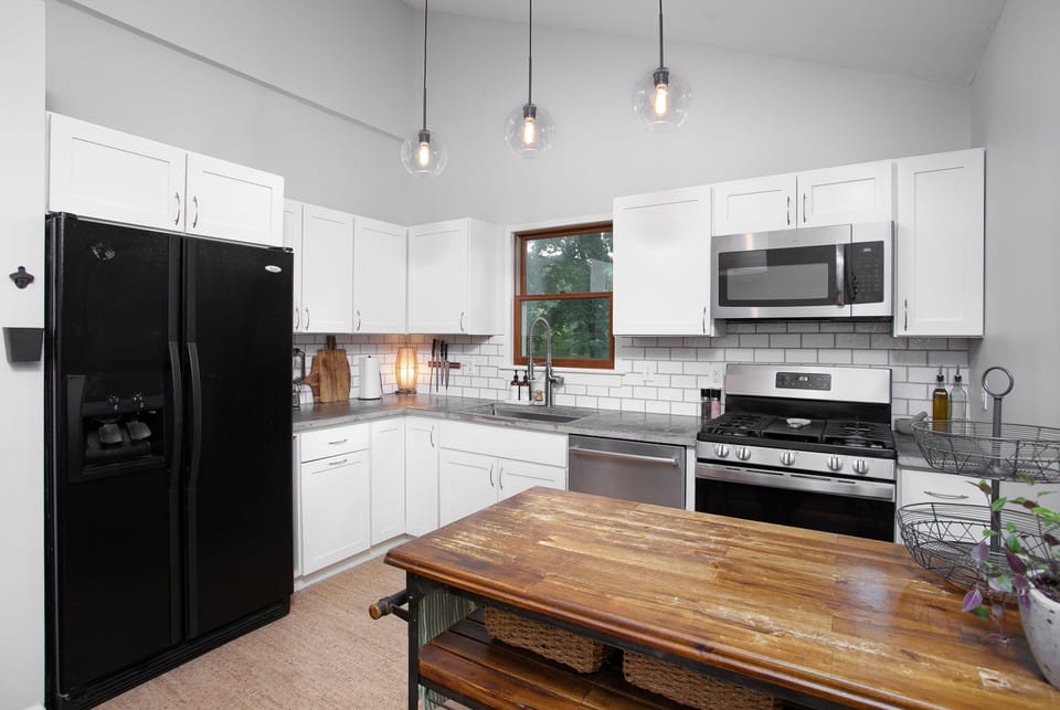 Cook with ease in the fully stocked kitchen with updated appliances.