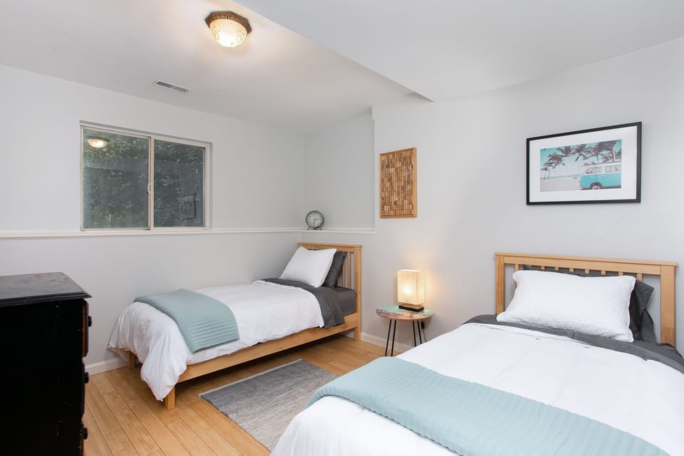 Lower-level twin bedroom; great setup for kids or flexible sleeping.