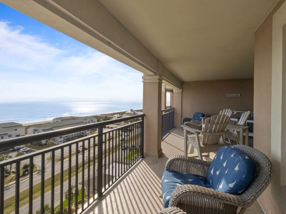 Relax in your private oceanview sanctuary with comfortable wicker seating and endless sea vistas stretching to the horizon.
