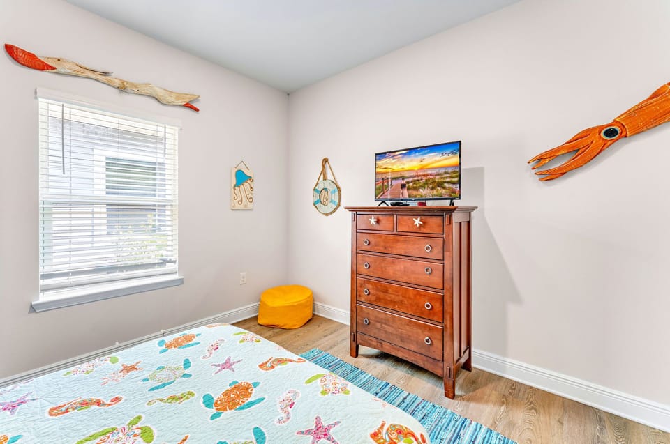 Bunk room with flatscreen tv