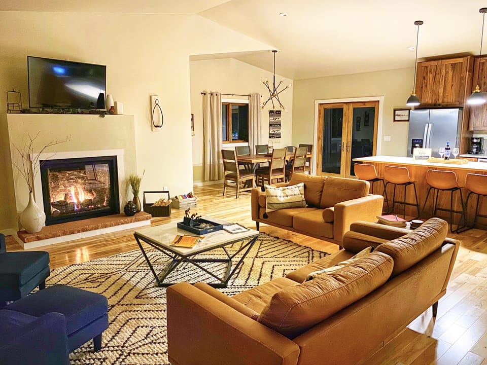 Great room with cozy fireplace, smart TV and plenty of comfy seating.  