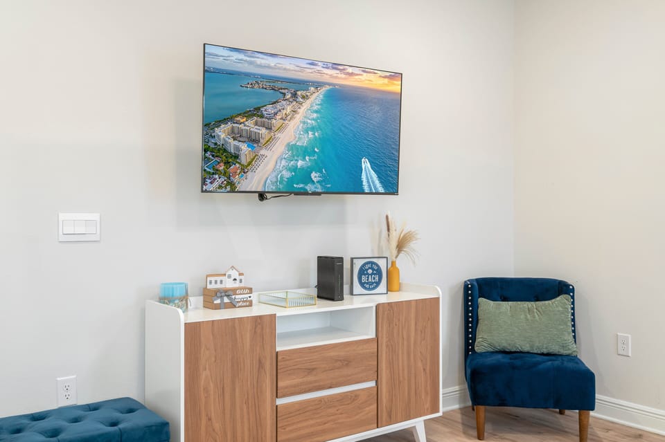 Master Bedroom with 50" ROKU TV, modern TV stand& accent chairs