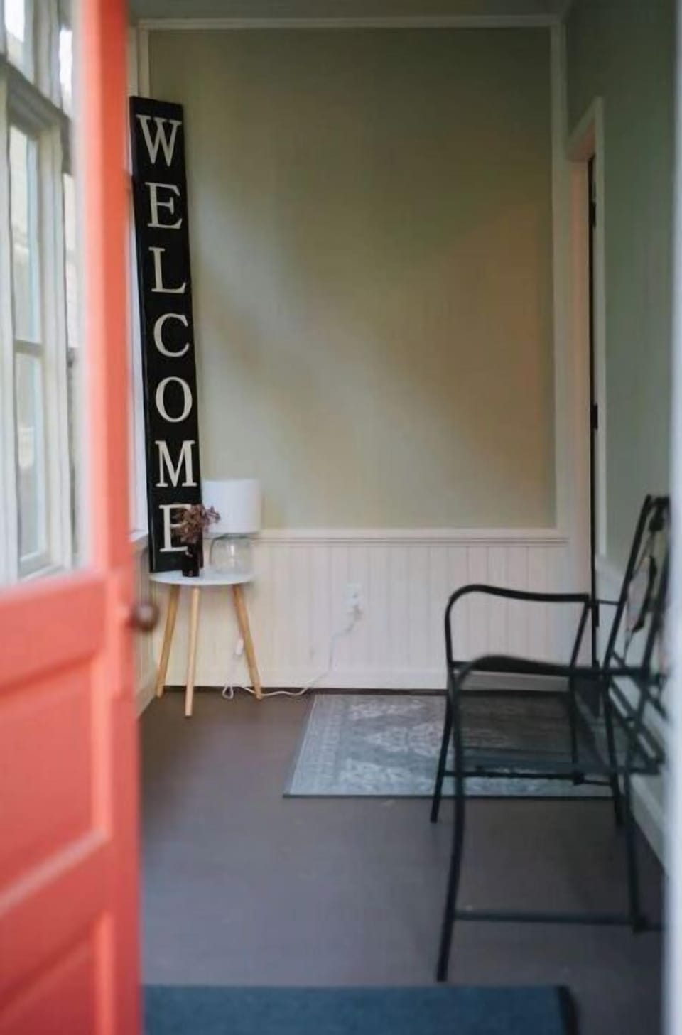 The sunny back porch welcomes you with a smart lock and customized code.