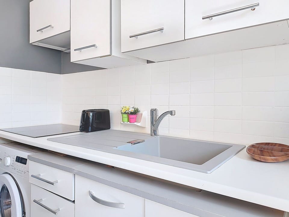 Countertop, Kitchen, Flooring, Interior Design, Cabinetry, Sink, Plumbing Fixture, Tap, Floor, Kitchen Sink