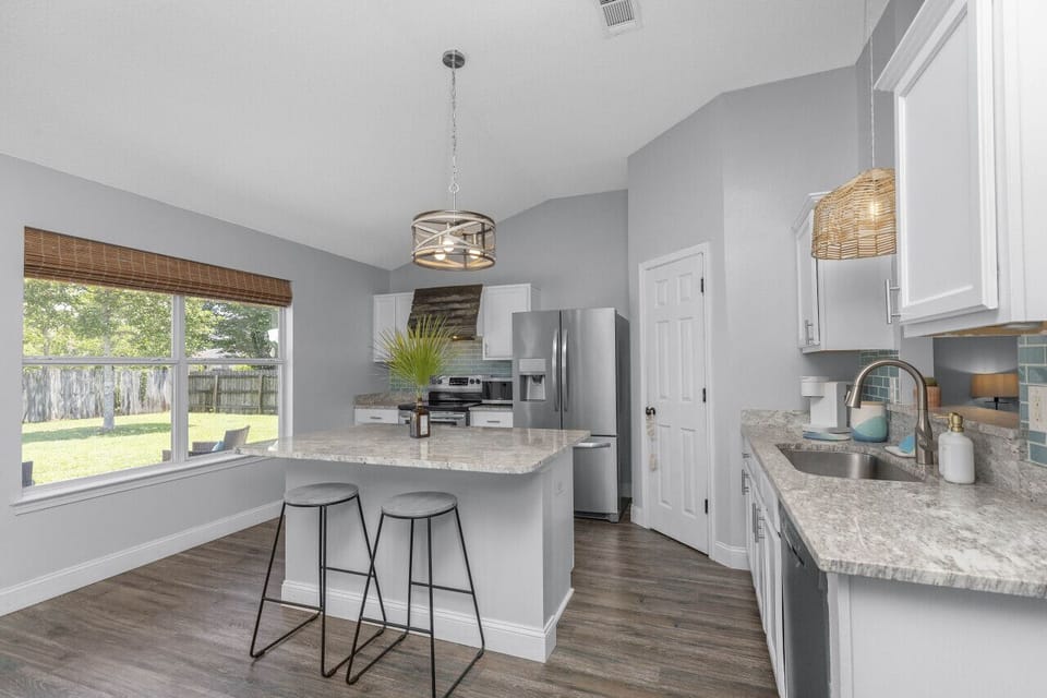 Open kitchen with private backyard views