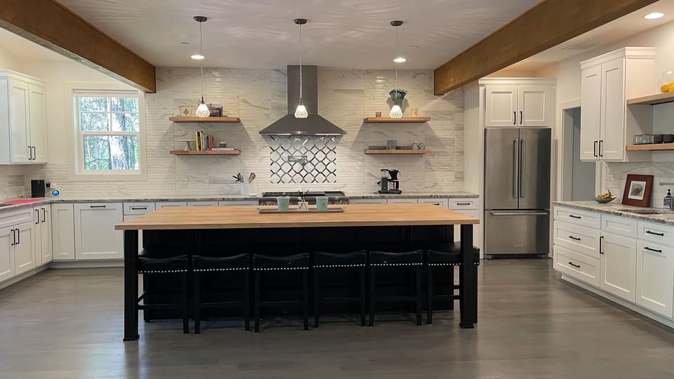 Large kitchen with butcher’s block island seating six 