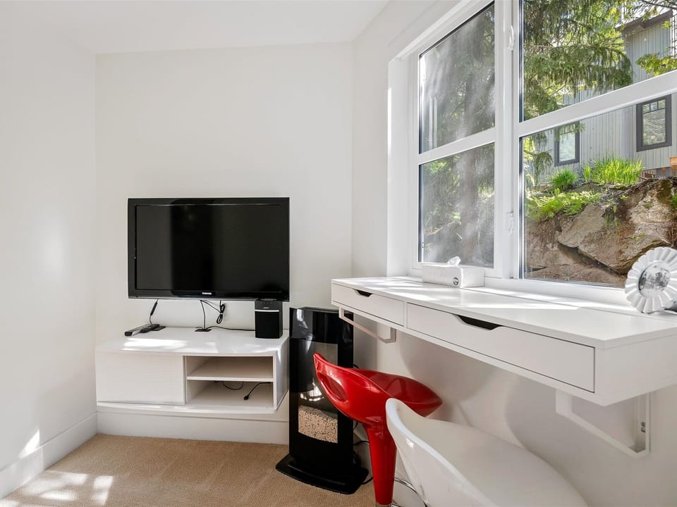 Kids' room/work station - leave the kids here to lounge on the bean bags and watch/play on the TV while the adults enjoy upstairs. Or use the desk as a quiet workstation.