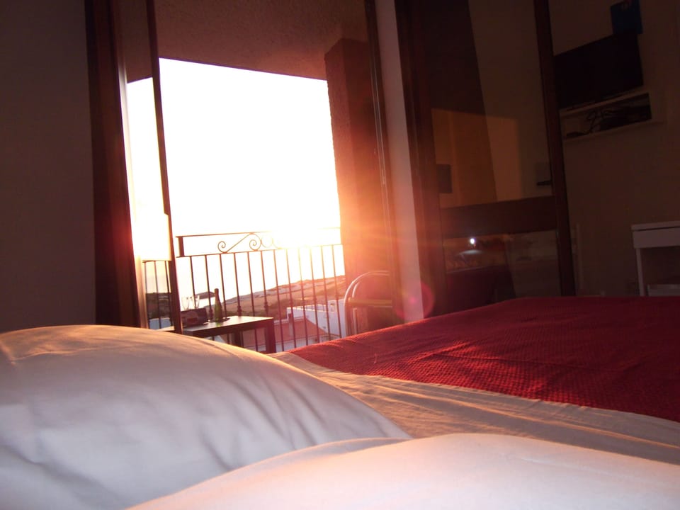 Triple Room, Balcony, Sea View | Minibar, in-room safe, desk, blackout drapes