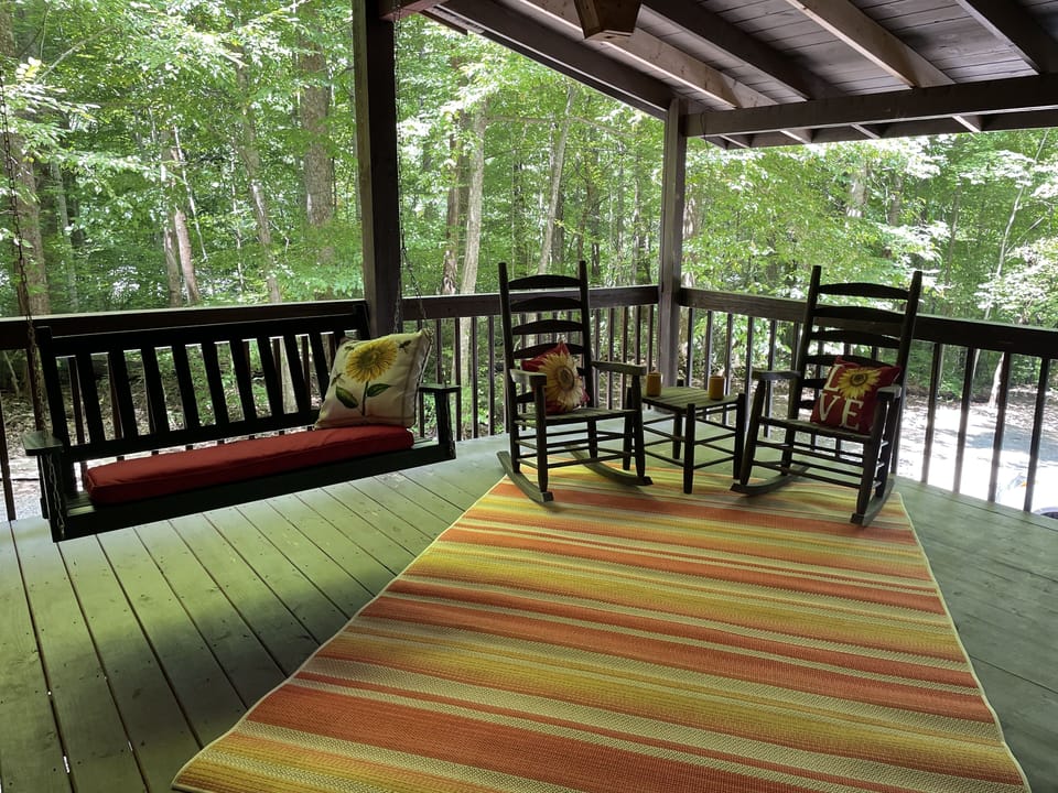 Swing and rocker area of covered porch