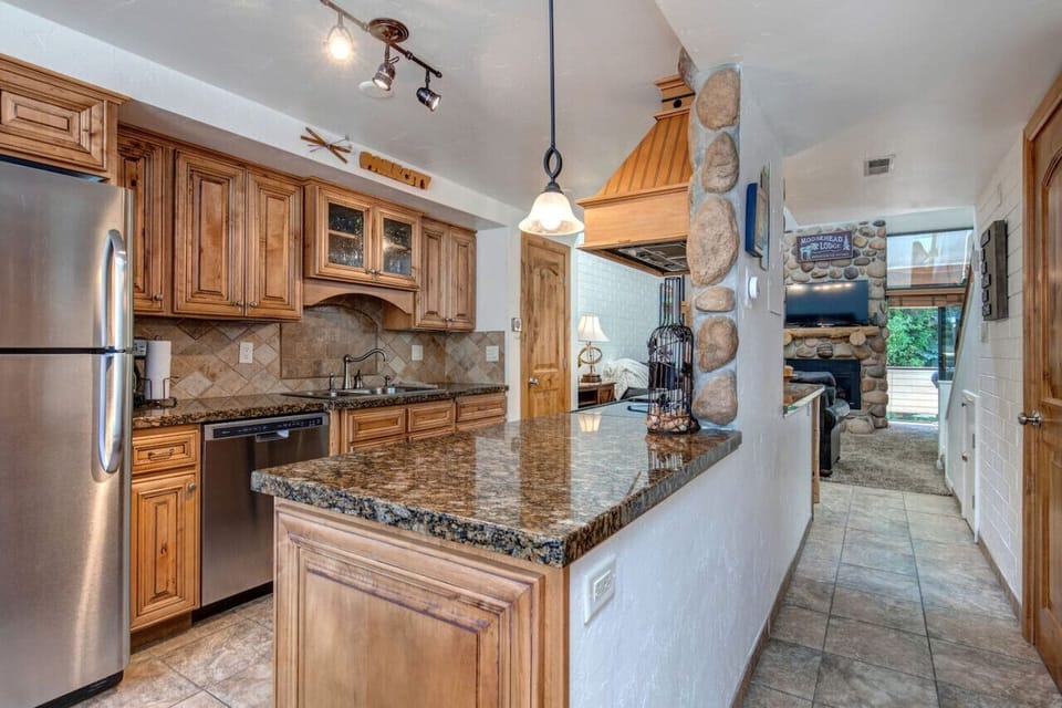 The condo kitchen has a large island for cooking