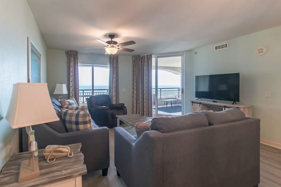 Relax in your spacious living room with ocean views from your private balcony and all the comforts of home.