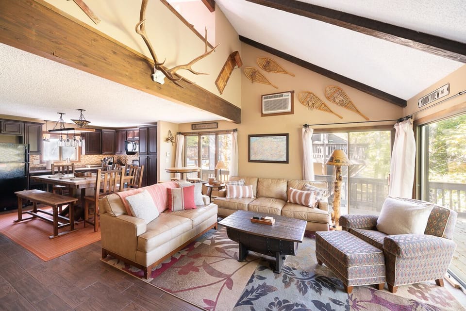 Spacious living room area with gas powered fire place, 65" Smart Tv and AppleTV