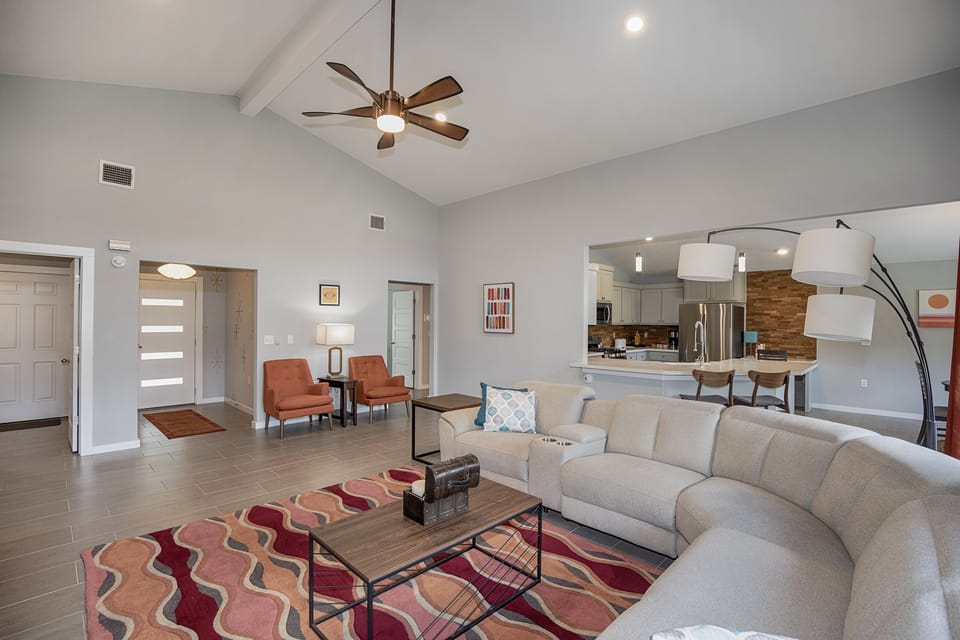 living area with sofa with electric recliners