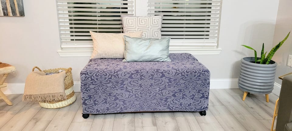 Ottoman in living room converts to a twin bed.  See next picture.