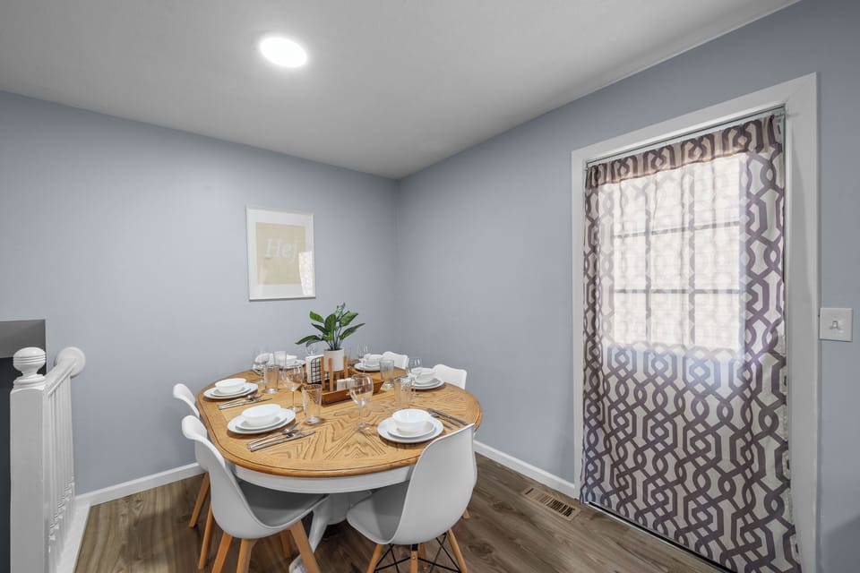 Charming dining nook with seating for six. Bright, cozy, and great for meals.
