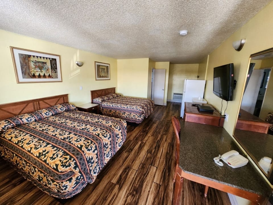 Basic Room, 2 Queen Beds, Smoking, Refrigerator & Microwave | Laptop workspace, free WiFi, bed sheets