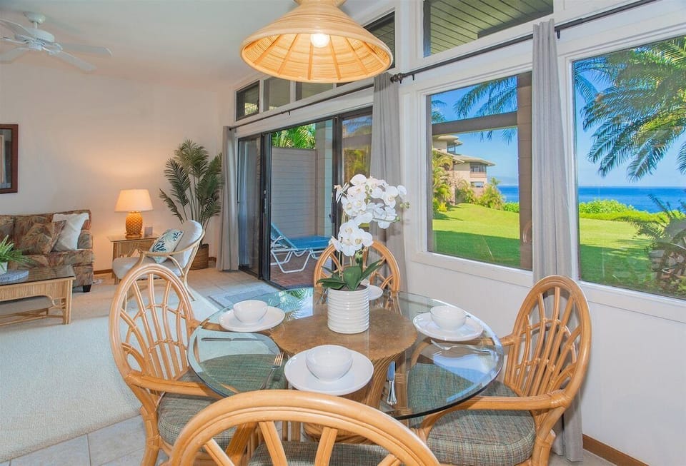 A dining room table sits just off the living room and provides enough seating to comfortably seat four