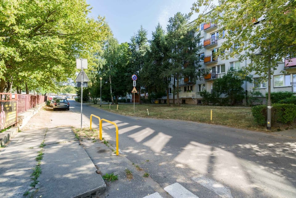 A view of the surrounding neighborhood, showcasing quiet streets and nearby greenery, adding to the peaceful atmosphere.
